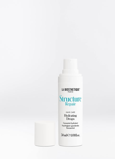 Structure Repair Drops are supplied with a combination of hyaluronic acids and red sea grass to condition dry, stressed hair and repair the cuticle so that the additional moisture remains safely sealed in the hair. Shop online or in-store at Shampoo Hair Bar in Victoria, BC.