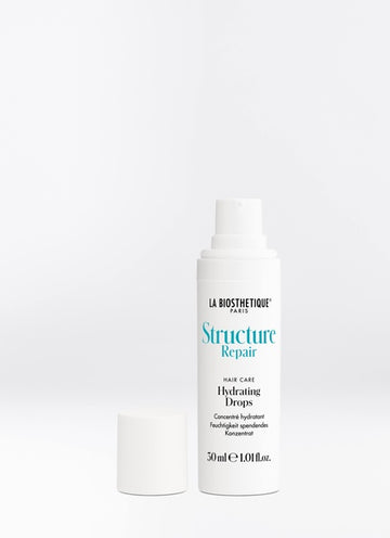 Structure Repair Drops are supplied with a combination of hyaluronic acids and red sea grass to condition dry, stressed hair and repair the cuticle so that the additional moisture remains safely sealed in the hair. Shop online or in-store at Shampoo Hair Bar in Victoria, BC.
