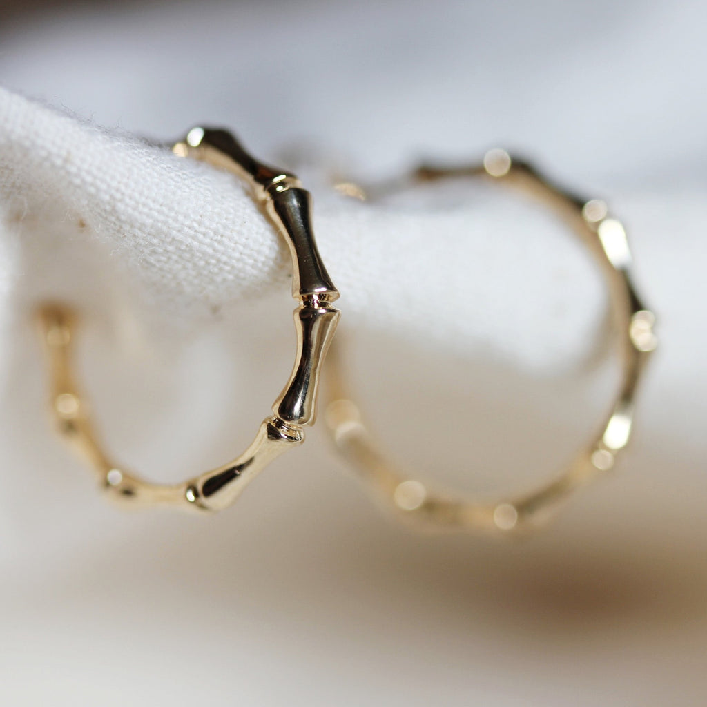 A close up of the Bamboo texture on Little Gold hoops for sale at Shampoo Hair Bar