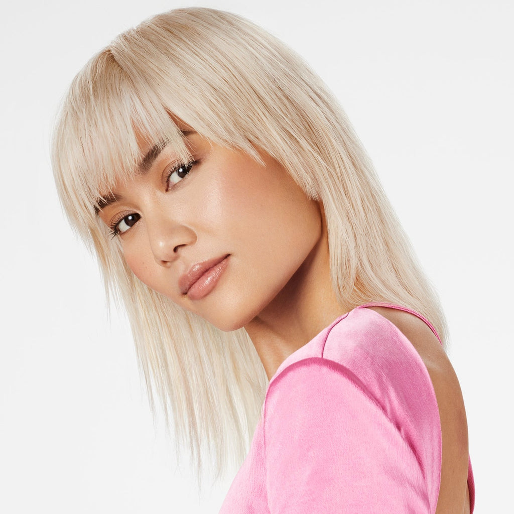 A model with healthy bleached hair after using k18 from Shampoo Hair Bar