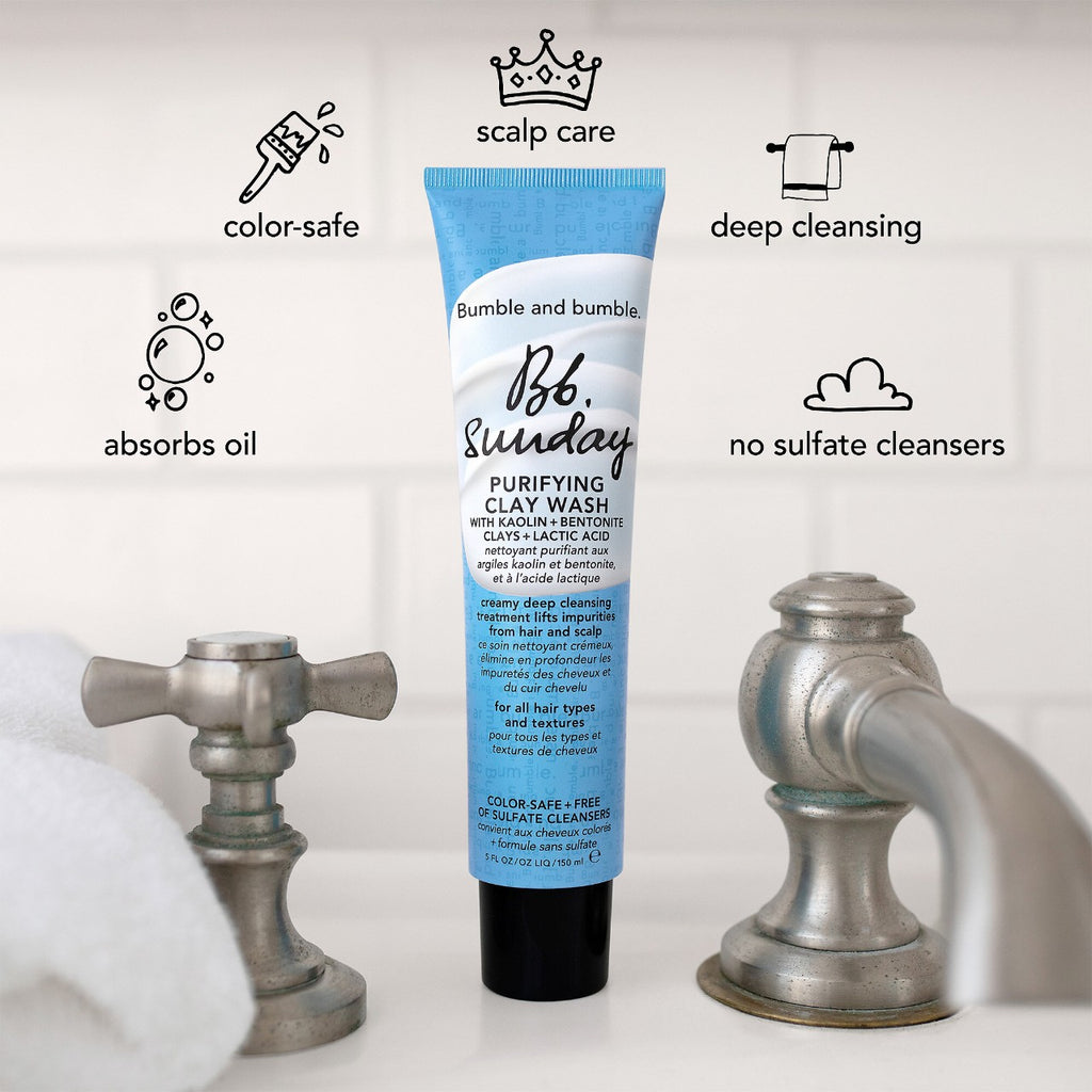 A tube of Bumble and Bumbles purifying clay wash surrounded by the benefits. Deep cleansing weekly shampoo that absorbs oil, is colour safe, free of sulfate cleansers, and cares for your scalp.